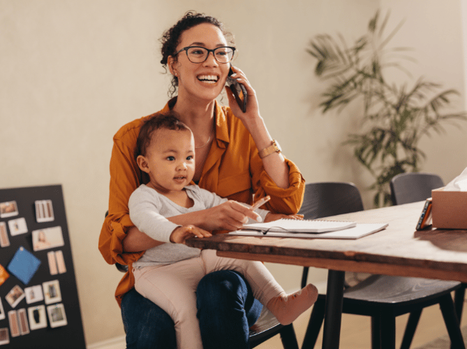 mum-on-the-phone-with-child-on-knee